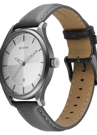 a silver and black watch with a brown strap