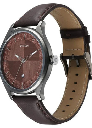 a watch with a brown leather strap