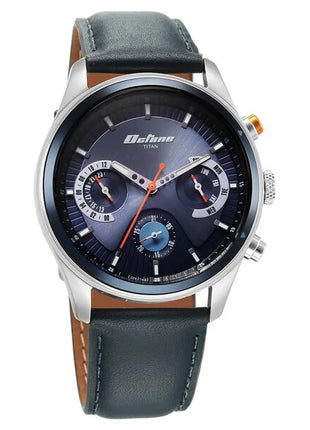 a watch with a blue dial and brown leather strap