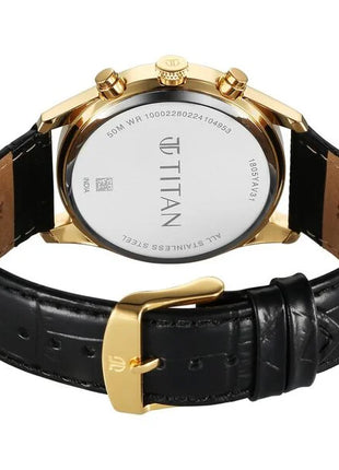 a watch with a gold case and black leather strap