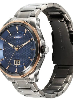 a watch with a blue dial and two tone steel bracelet