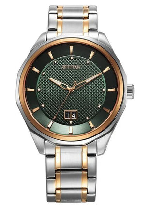 a silver and gold watch with a green dial