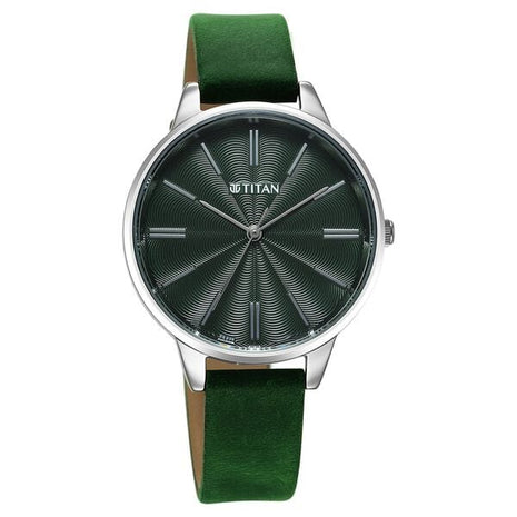 a green watch with a silver case on a white background