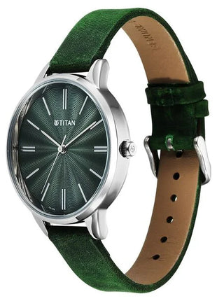 a green watch with a leather strap