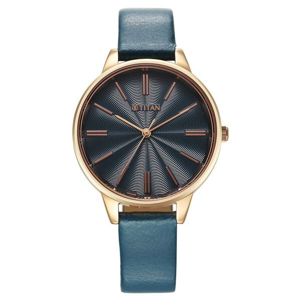 a blue watch with a gold case