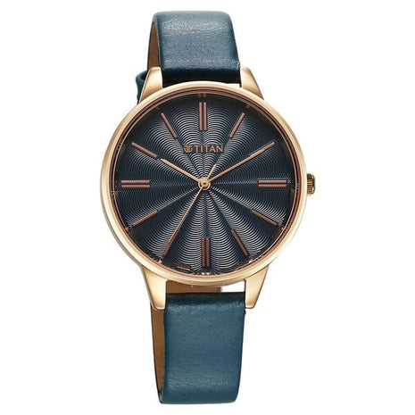 a watch with a blue leather strap