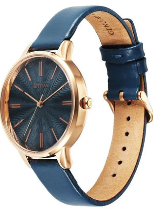 a watch with a blue strap and a gold case