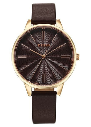 a watch with a brown leather strap