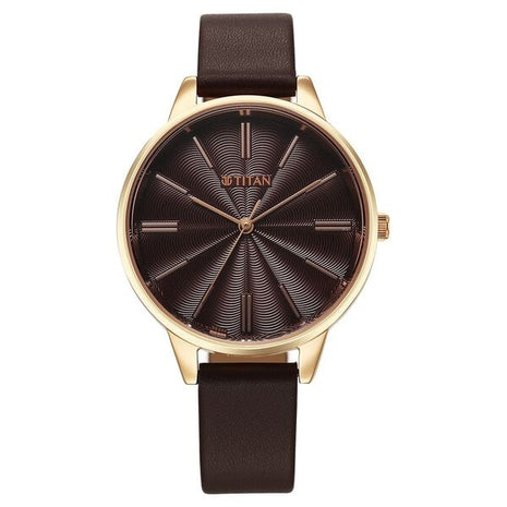 a watch with a brown leather strap