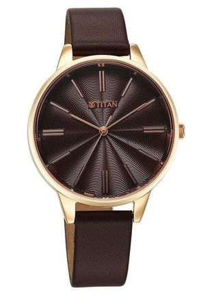 a watch with a brown leather strap