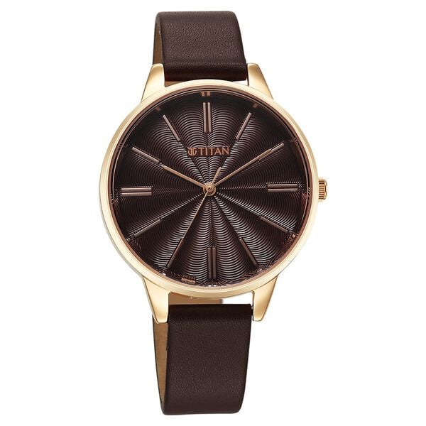 a watch with a brown leather strap