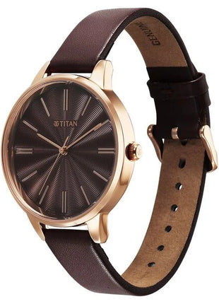 a watch with a brown leather strap