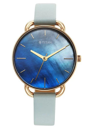 a watch with a blue dial and gold hands