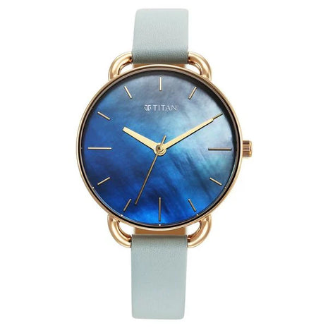 a watch with a blue dial and gold hands