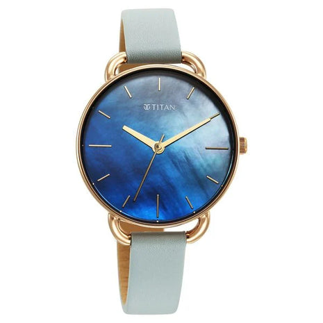 a watch with a blue dial and a gold case