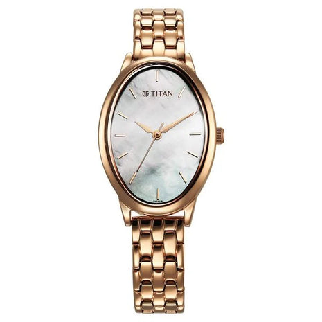 a gold watch with a mother of pearl dial