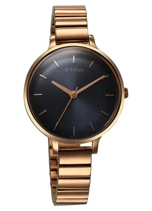 a gold watch with a black face on a white background