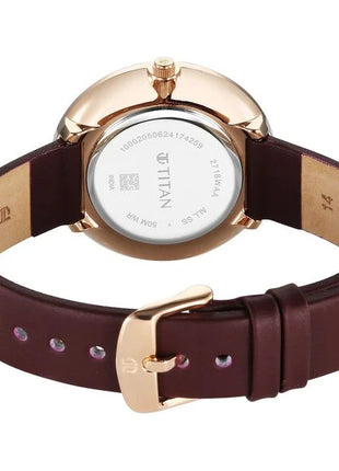 a women's watch with a brown strap