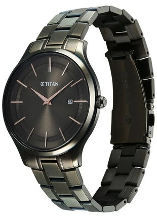 a stainless steel watch with a black dial