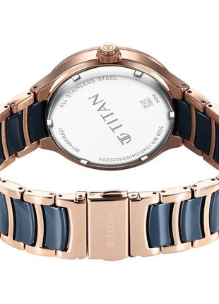 a men's watch with a blue and rose gold bracelet