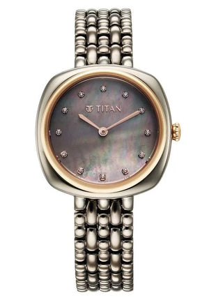 a women's watch with a mother of pearl dial