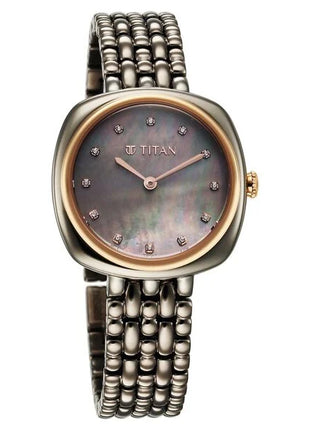 a women's watch with a mother of pearl dial