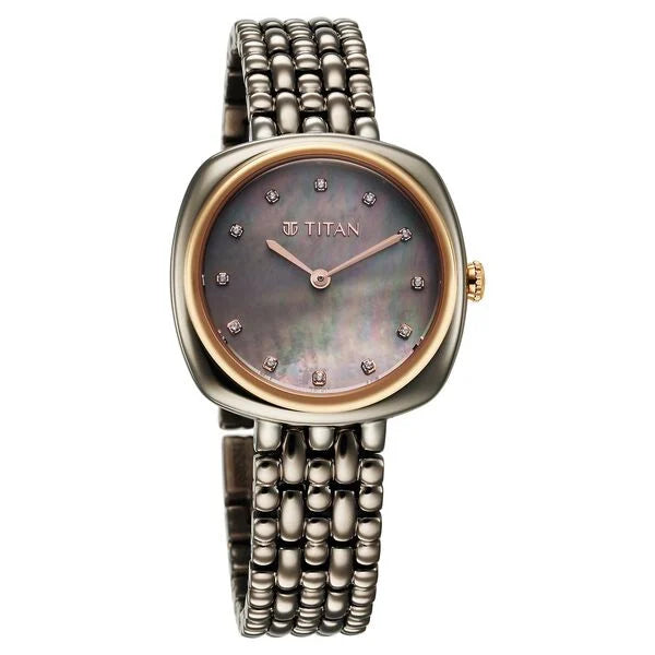 a women's watch with a mother of pearl dial