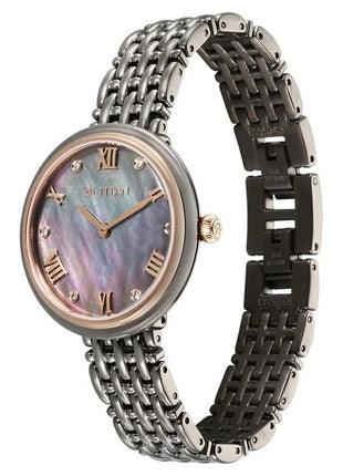 a women's watch with a mother of pearl dial