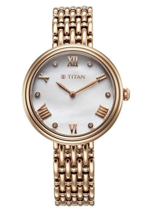 a gold watch with roman numerals and a white dial