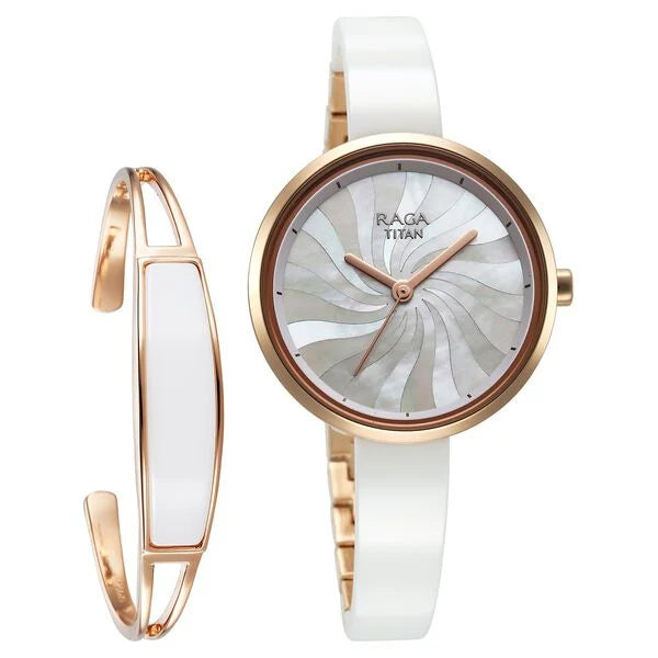 Stylish Titan Raga Memoirs watch featuring a mother of pearl dial and white ceramic strap, presented alongside a matching bangle.