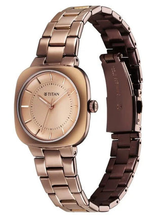 a women's watch with a gold dial