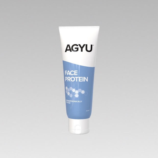 a tube of face protein on a gray background