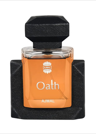 an orange and black bottle of perfume on a white background