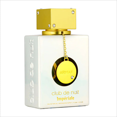 a bottle of perfume with a gold chain around it