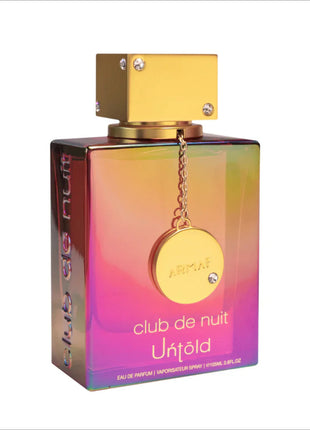 a bottle of perfume with a chain around it