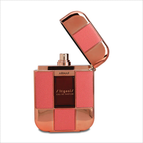 a bottle of perfume with an open lid