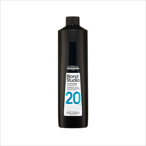 a black bottle of hair color on a white background