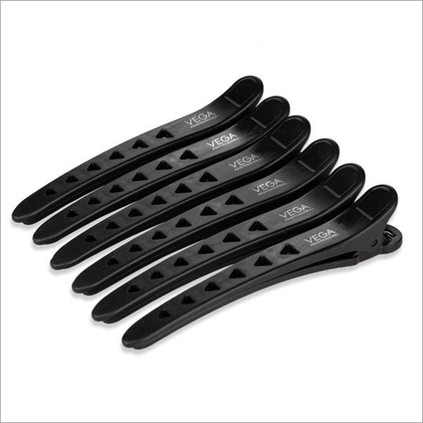 a set of five black plastic hair clips