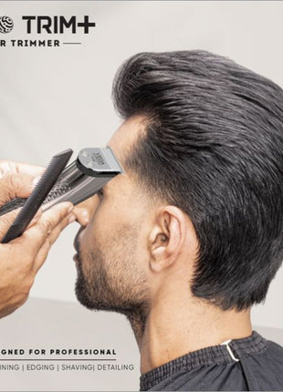 a man is cutting his hair with a hair trimmer