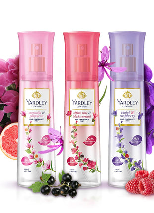 three bottles of yardley body wash next to flowers